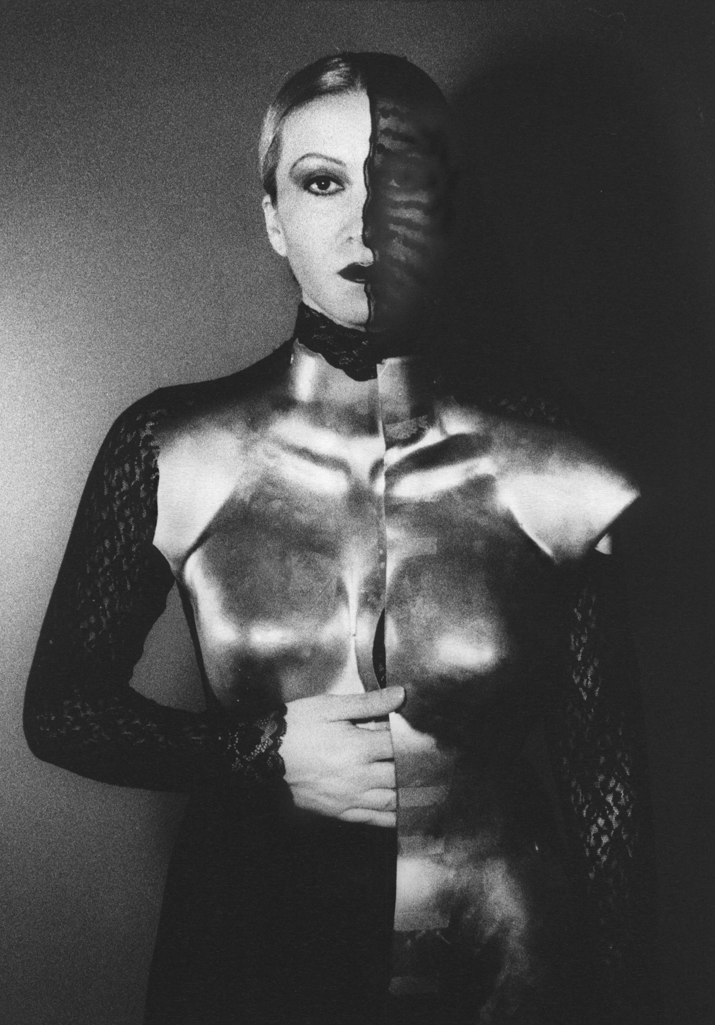 Two brides wrapped in red ribbon, seated