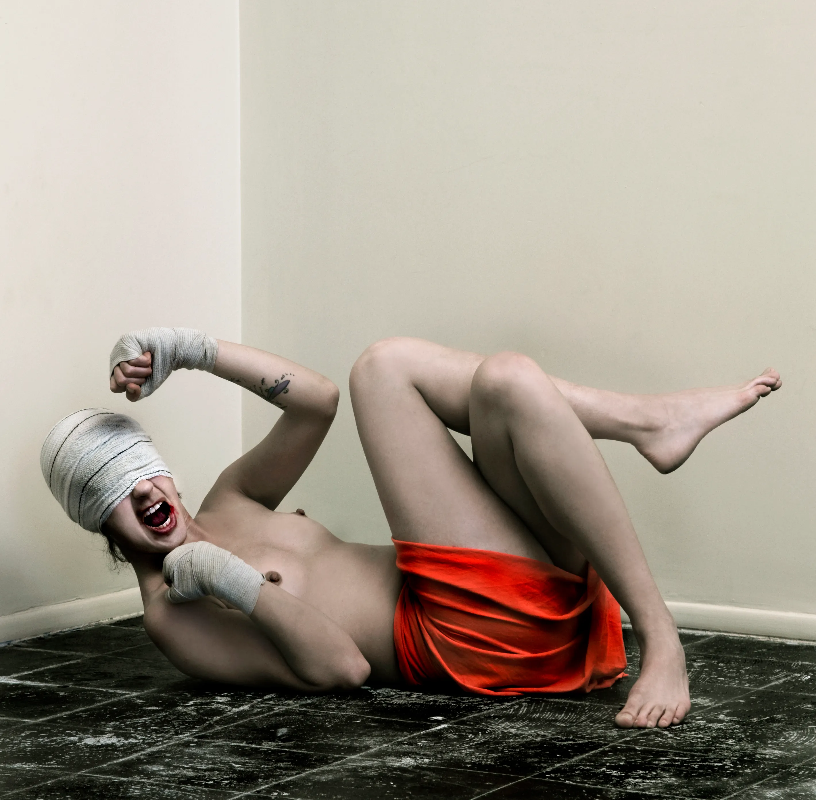 Figure standing against a plain background